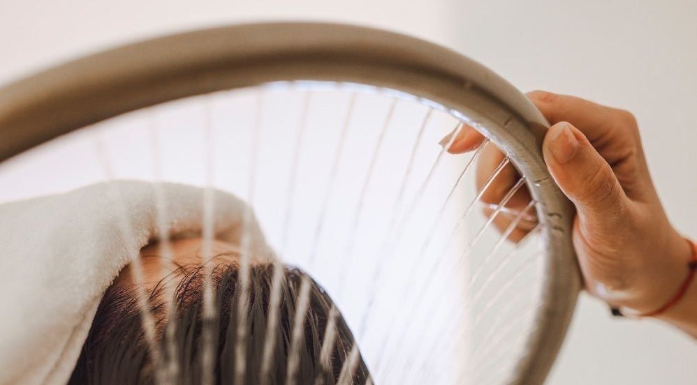 A soothing head massage setup at The Lash Squad in Melbourne, Victoria, AU featuring calming techniques.