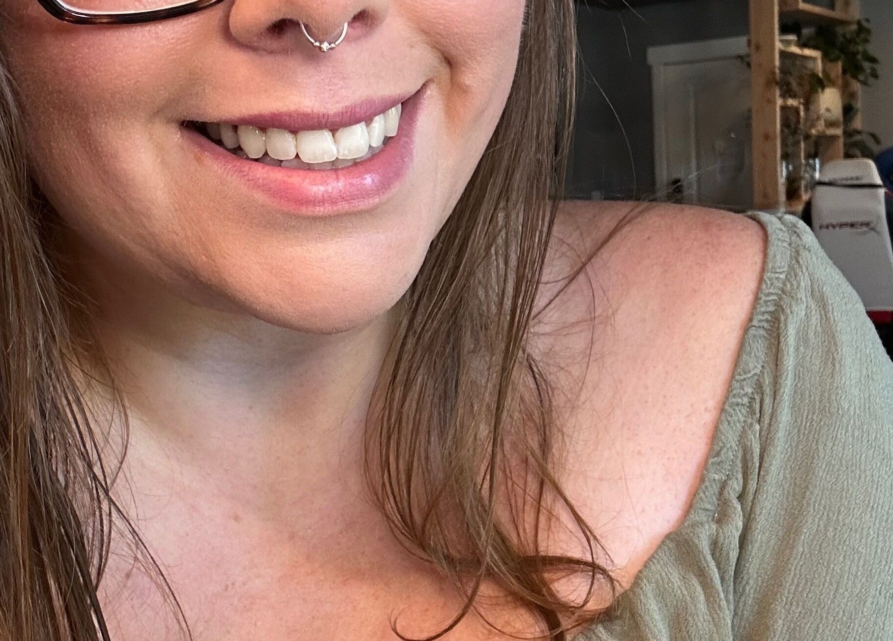 A woman with a radiant smile at Daisy Lane Esthetics, Port Alberni, British Columbia, CA.