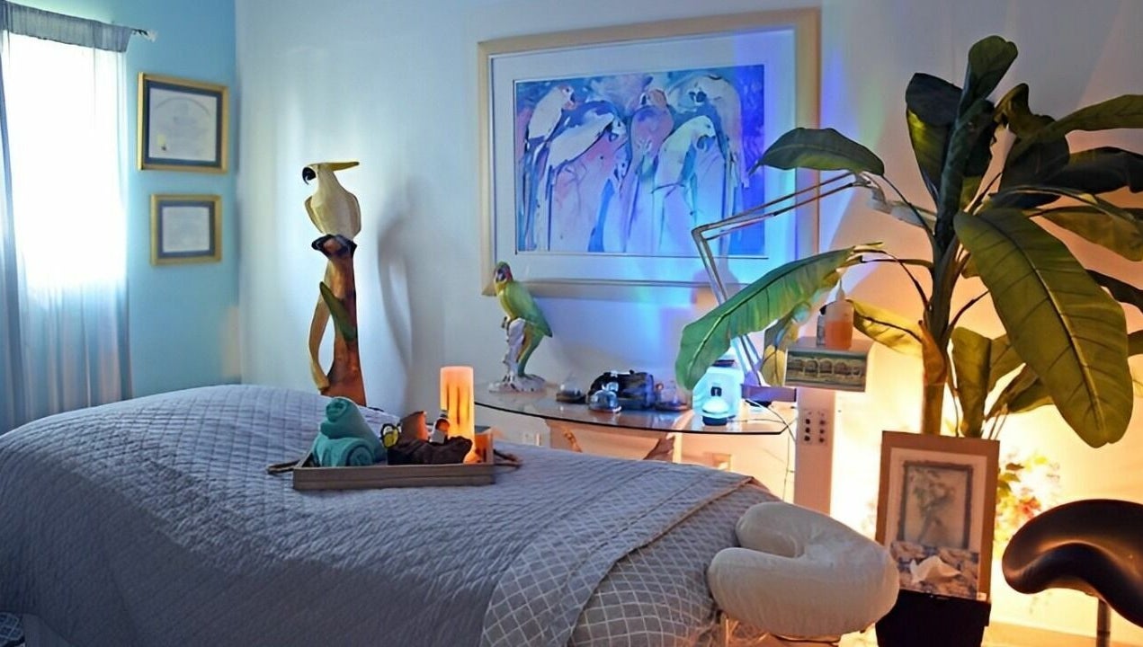 Serene massage room at The Palms Salon and Day Spa, LLC in Edgewater, Florida, US, featuring calming decor.