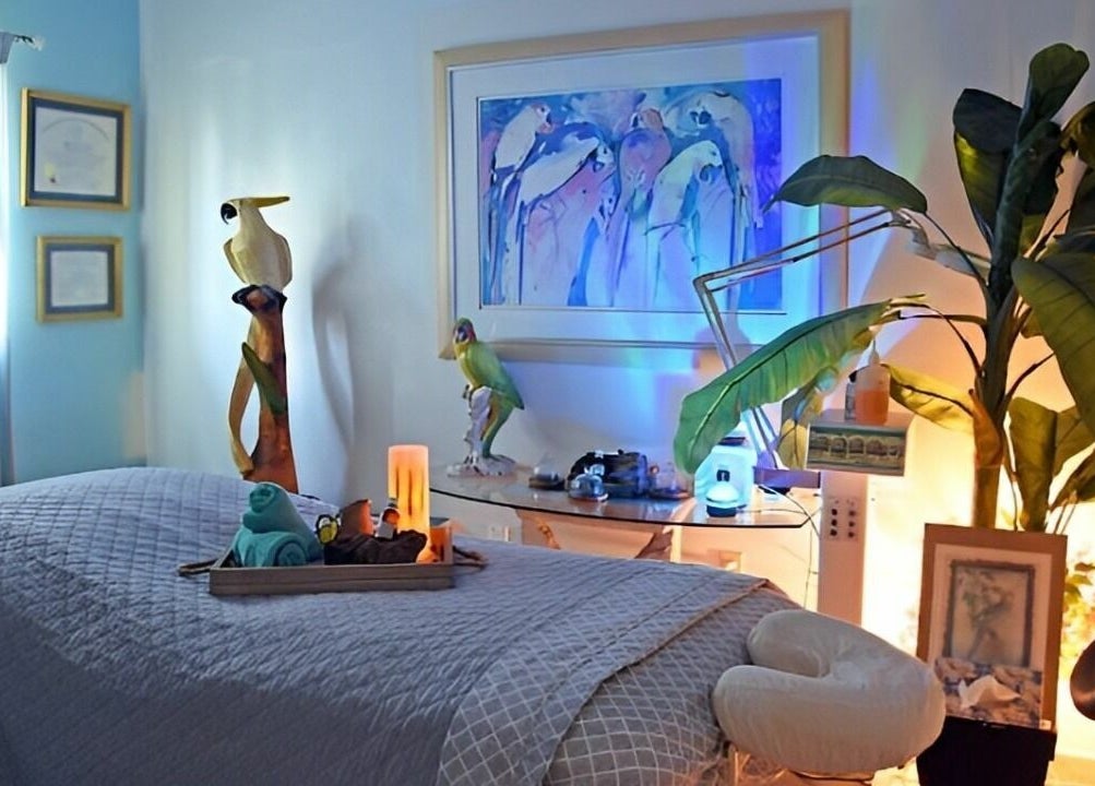 Serene massage room at The Palms Salon and Day Spa, LLC in Edgewater, Florida, US, featuring calming decor.