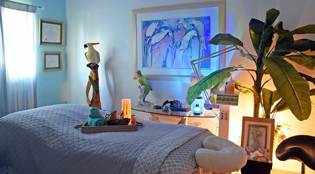 Serene massage room at The Palms Salon and Day Spa, LLC in Edgewater, Florida, US, featuring calming decor.