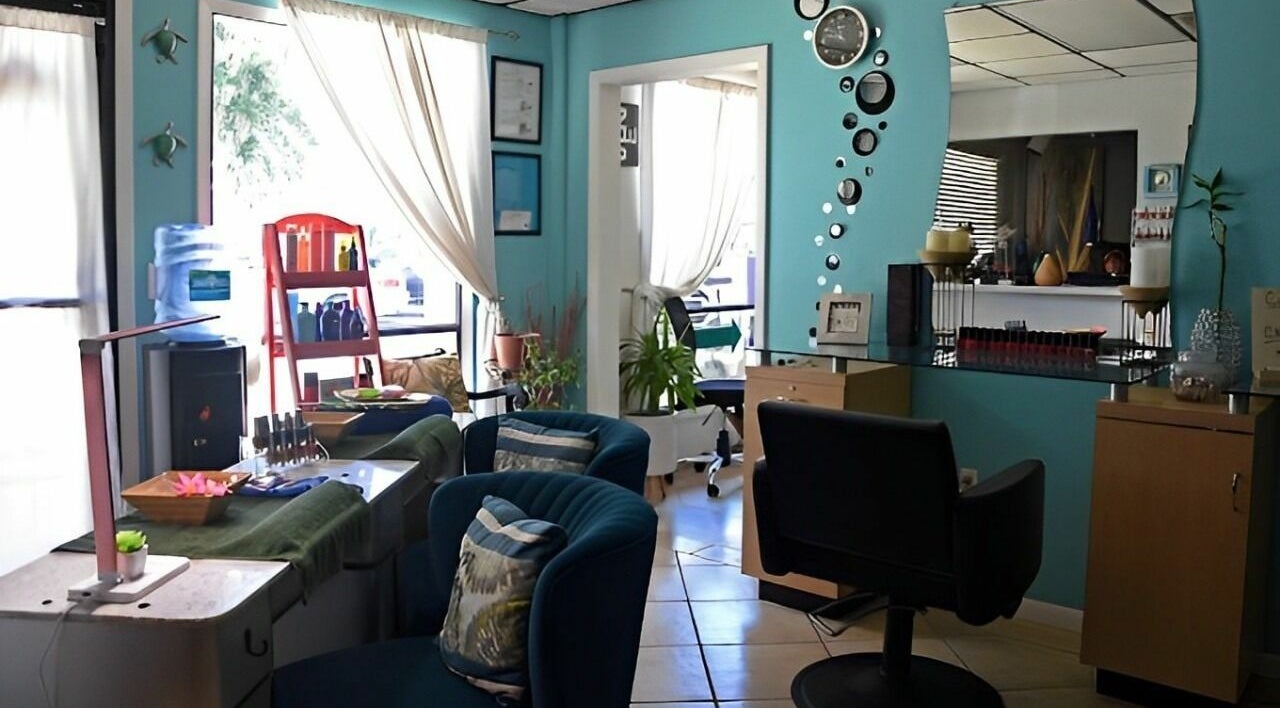 Interior of The Palms Salon and Day Spa, LLC, Edgewater, Florida, US with chic decor and comfortable seating.