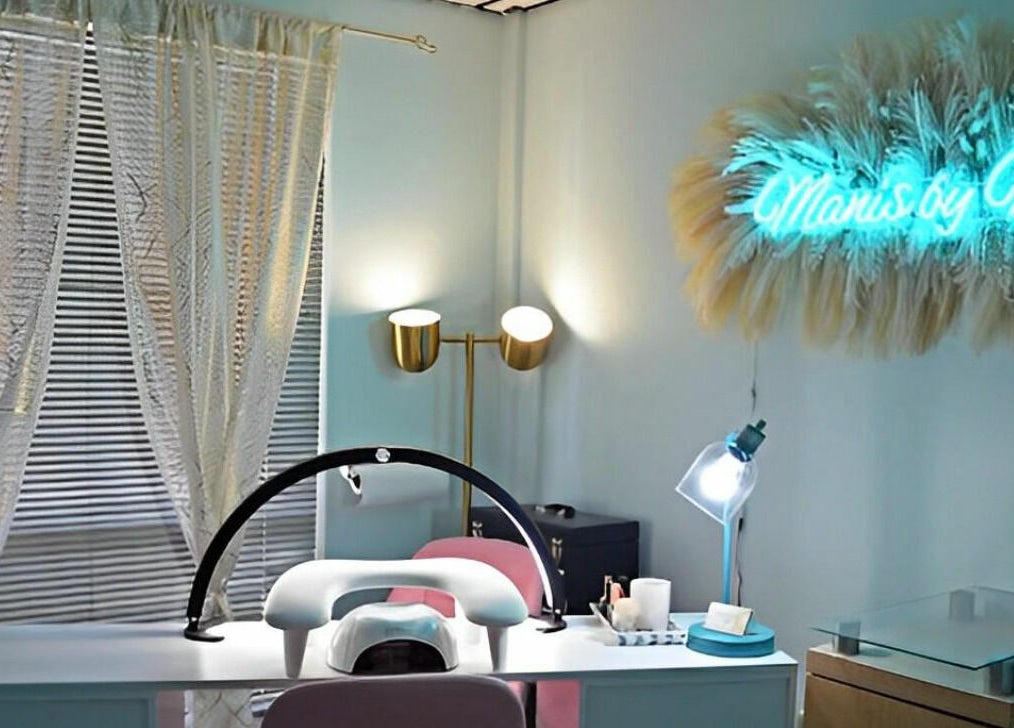 Modern manicure station at The Palms Salon and Day Spa, LLC in Edgewater, Florida, US with stylish lighting.