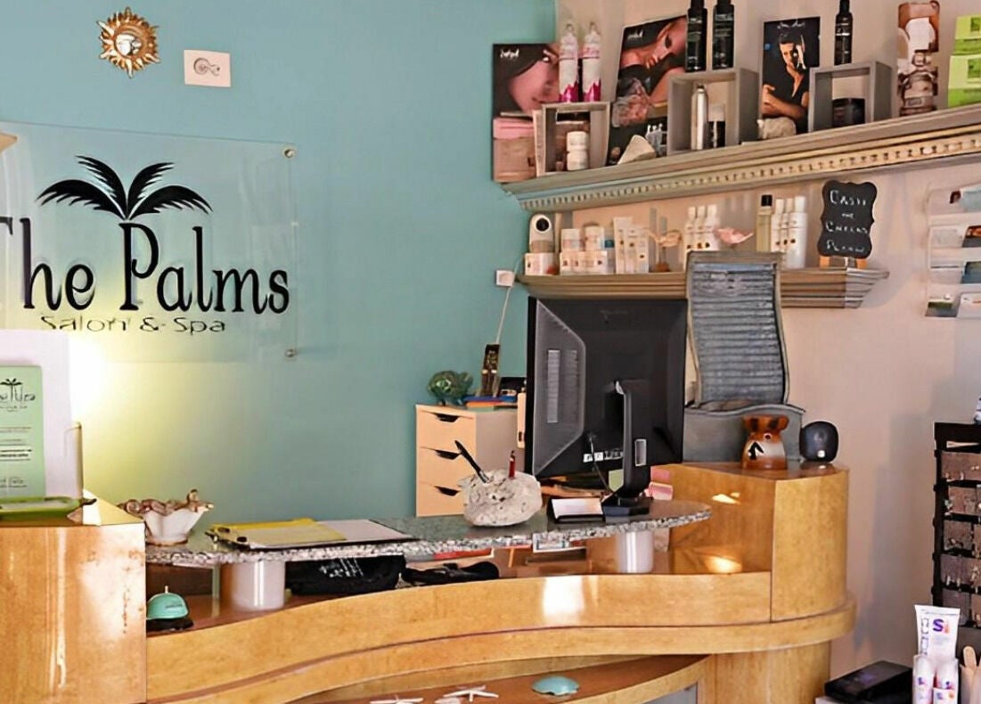 Front desk of The Palms Salon and Day Spa, LLC in Edgewater, Florida, US showcasing spa products and decor.