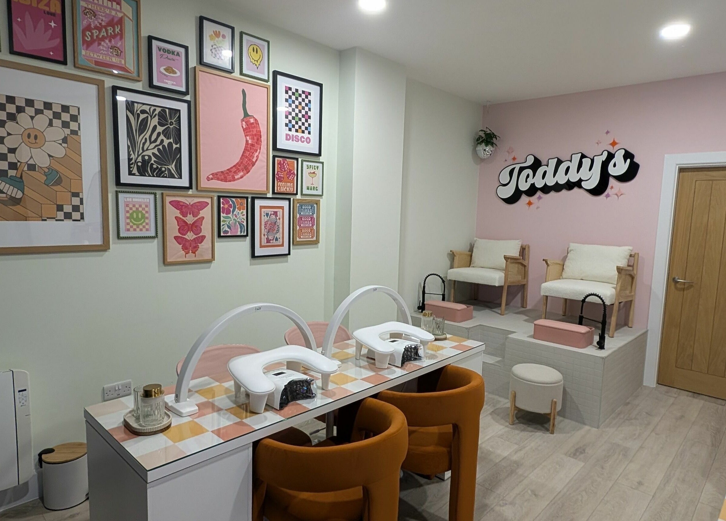 Stylish interior of Toddy's Nails Wadebridge, showcasing vibrant art and manicure stations in Wadebridge, England, GB.