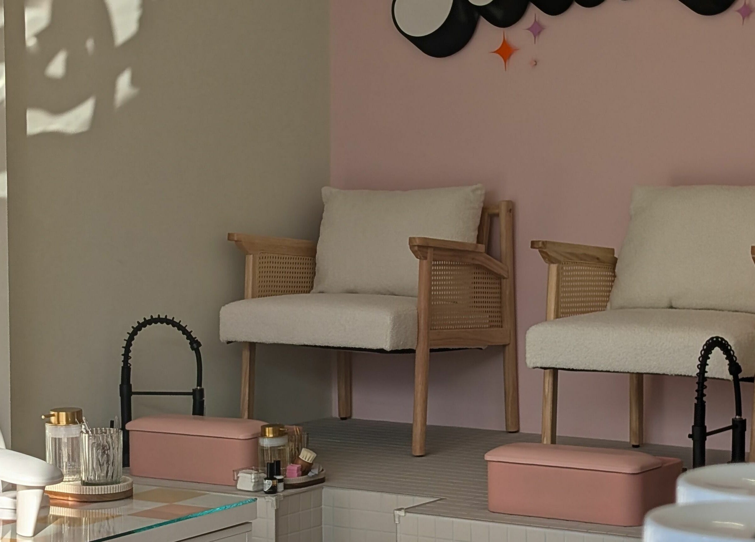 Elegant seating area at Toddy's Nails Wadebridge, featuring cushioned chairs and modern decor in Wadebridge, England, GB.