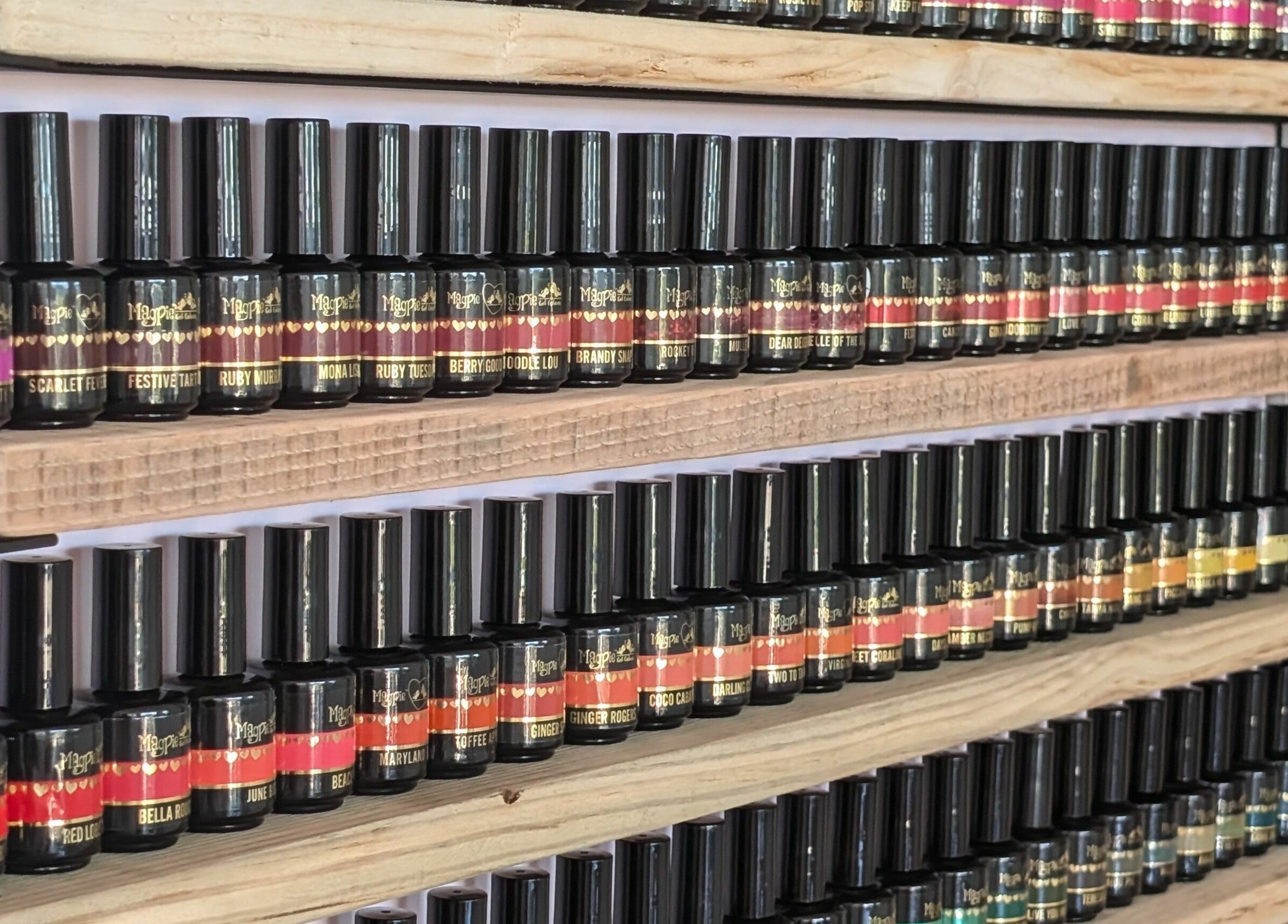 Colorful nail polish bottles neatly arranged at Toddy's Nails Wadebridge in Wadebridge, England, GB.