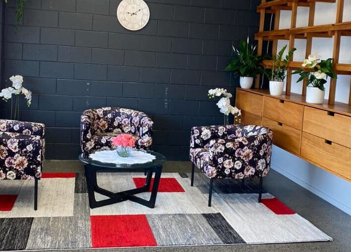 Cozy lounge with floral chairs at Belmont Thai Massage Station, Auckland, Auckland, NZ.