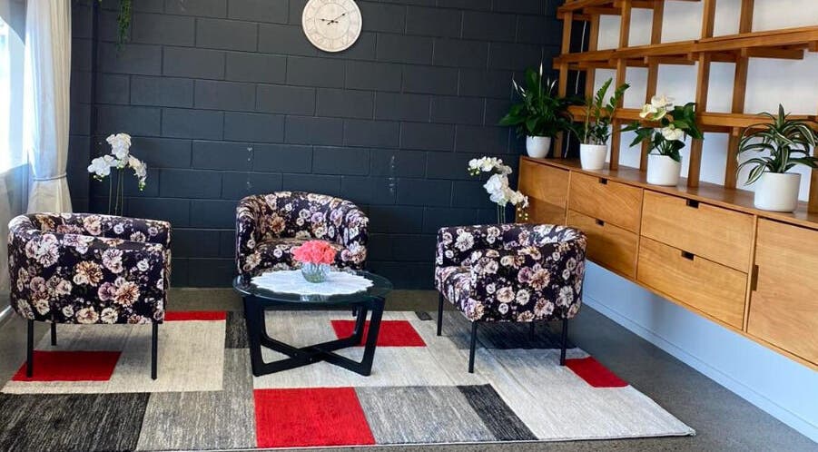 Cozy lounge with floral chairs at Belmont Thai Massage Station, Auckland, Auckland, NZ.