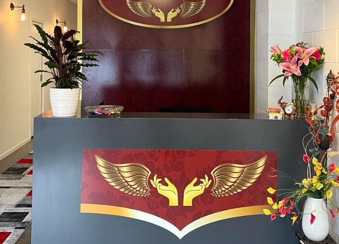 Reception area at Belmont Thai Massage Station in Auckland, Auckland, NZ, featuring elegant decor and vibrant flowers.