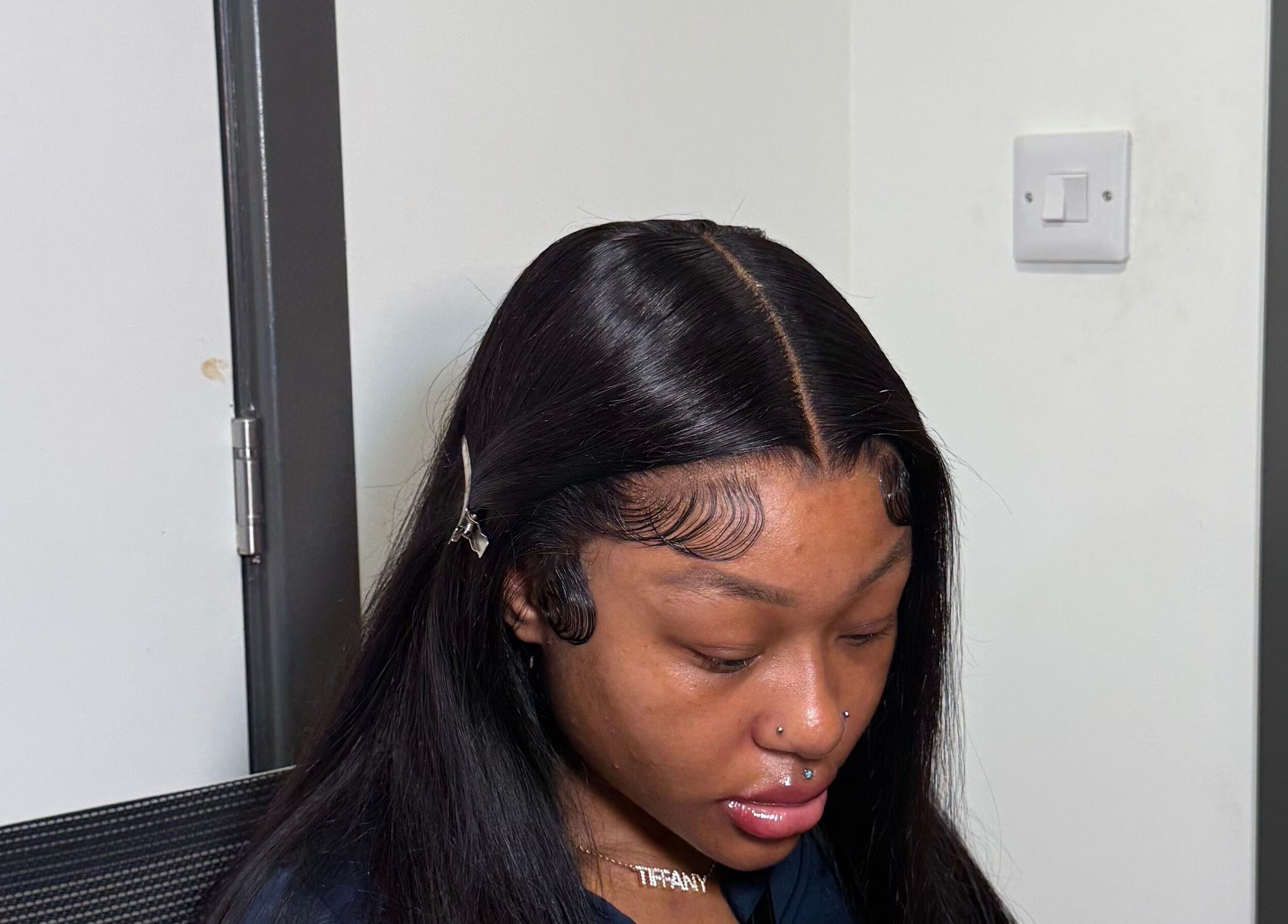 Close-up of sleek hair styling at Alacedit in Oldham, England, GB highlighting intricate edge work.