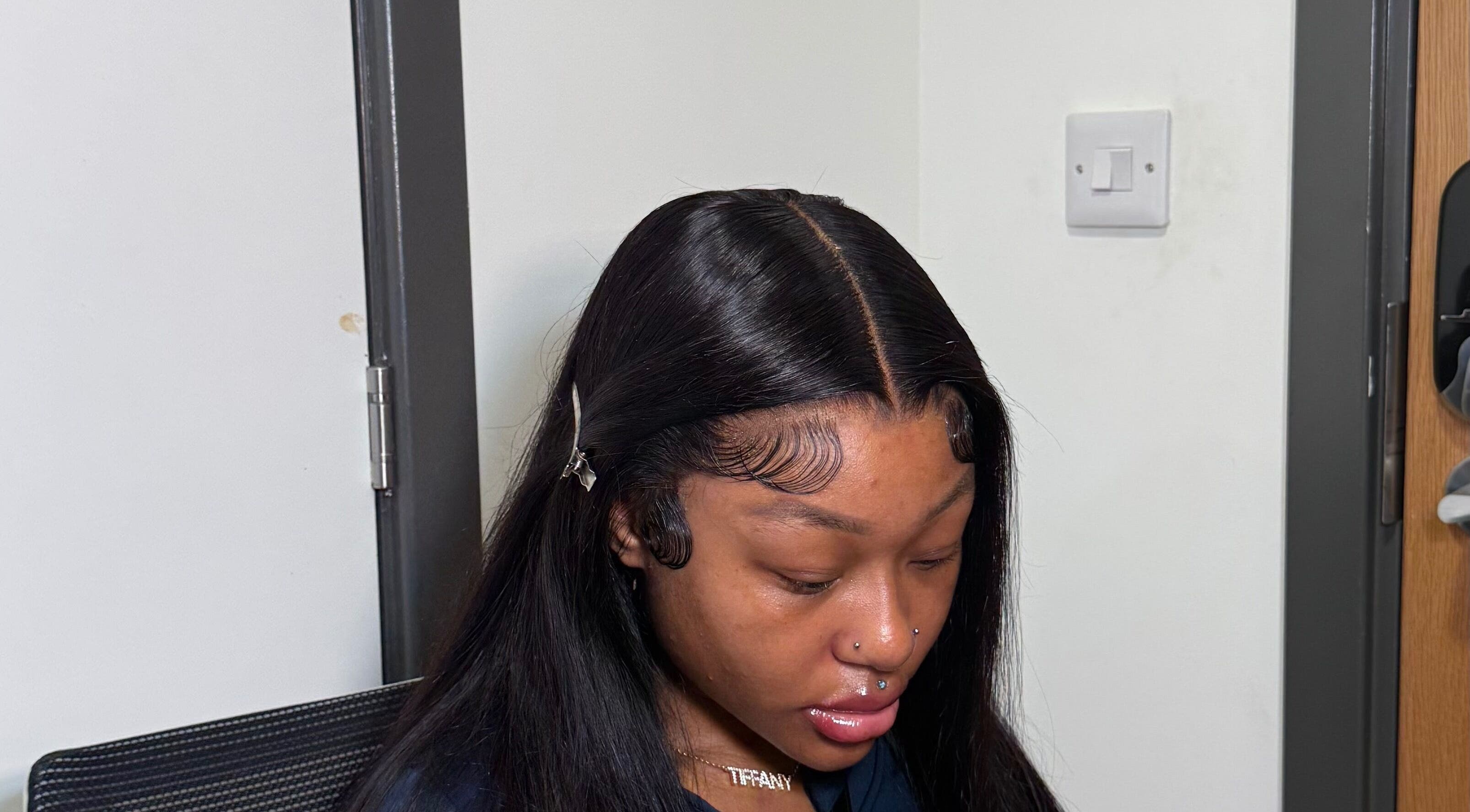 Close-up of sleek hair styling at Alacedit in Oldham, England, GB highlighting intricate edge work.