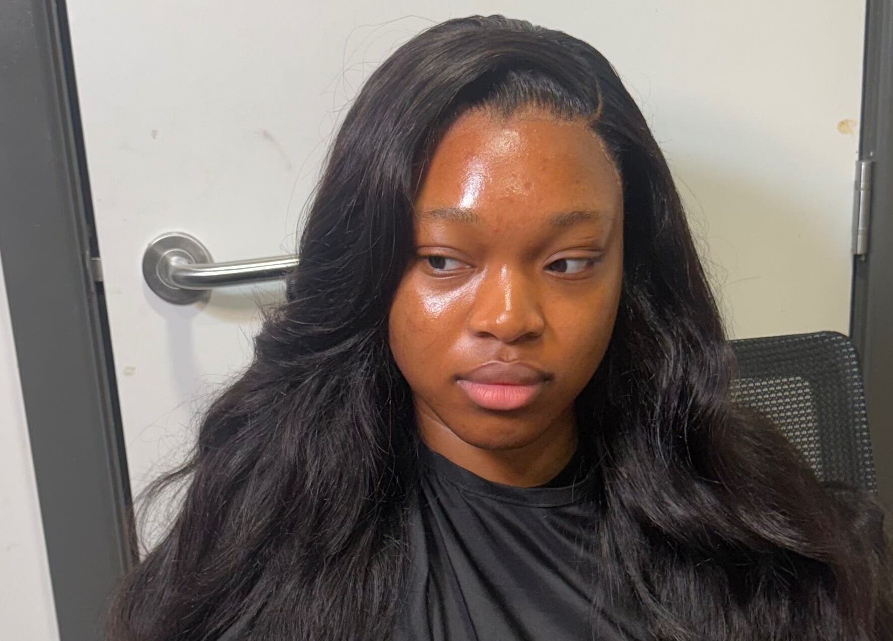 Elegant hairstyle at Alacedit, Oldham, England, GB showcasing sleek, glossy black hair.