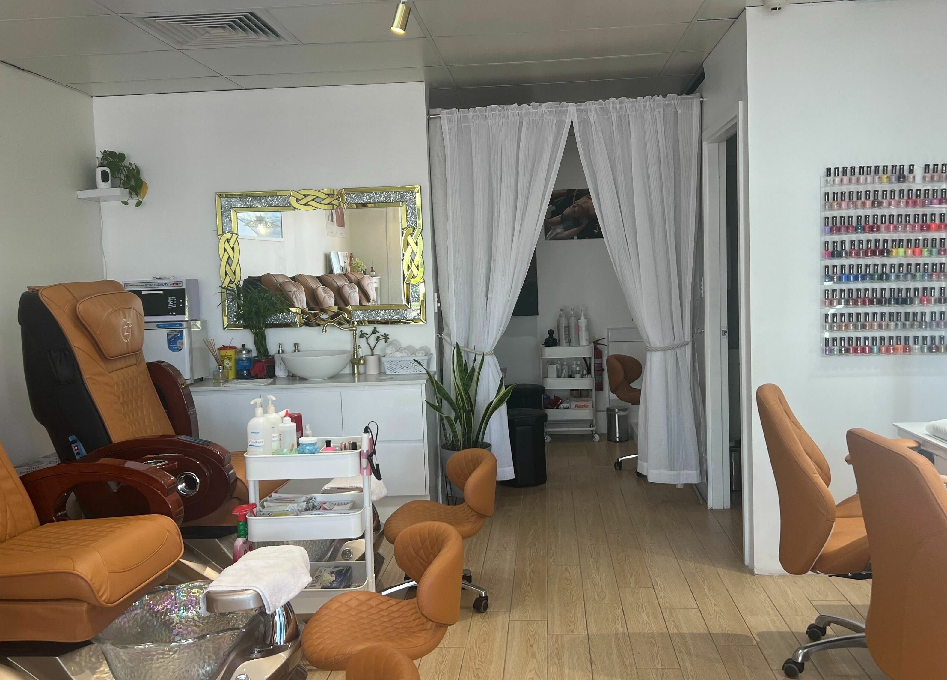 Modern interior of Beaufort Central Nails and Beauty, Perth, Western Australia, AU, with spa chairs and nail polish display.