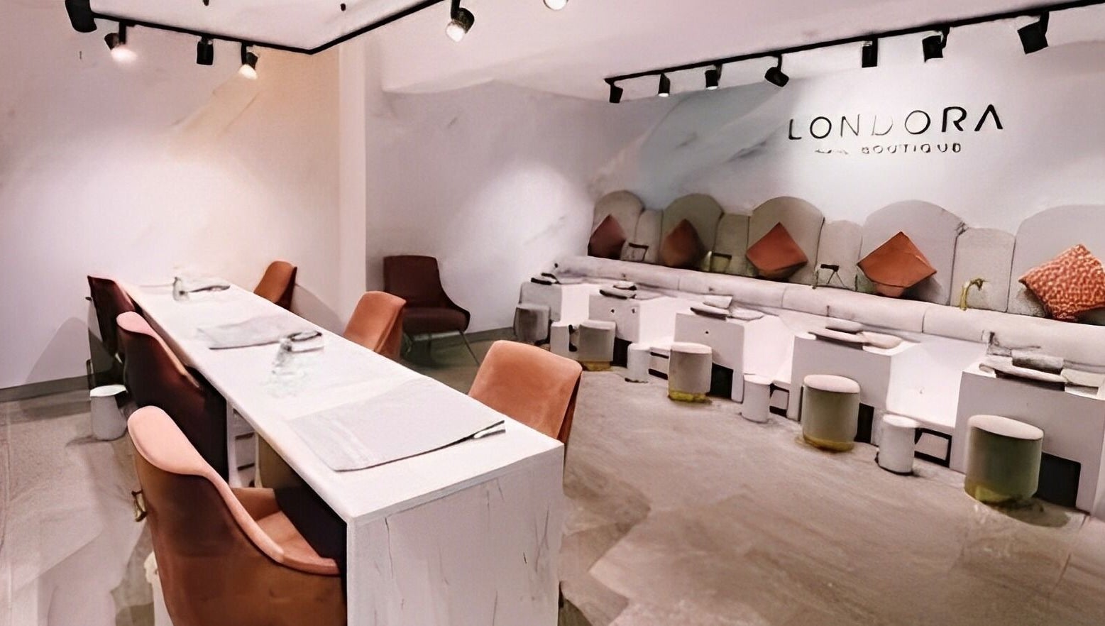 Sleek and modern interior of Londora Nail Boutique in London, England, GB with plush seating and stylish decor.