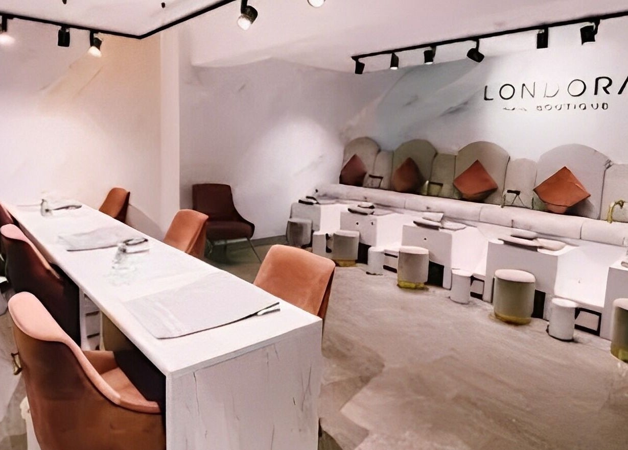 Sleek and modern interior of Londora Nail Boutique in London, England, GB with plush seating and stylish decor.
