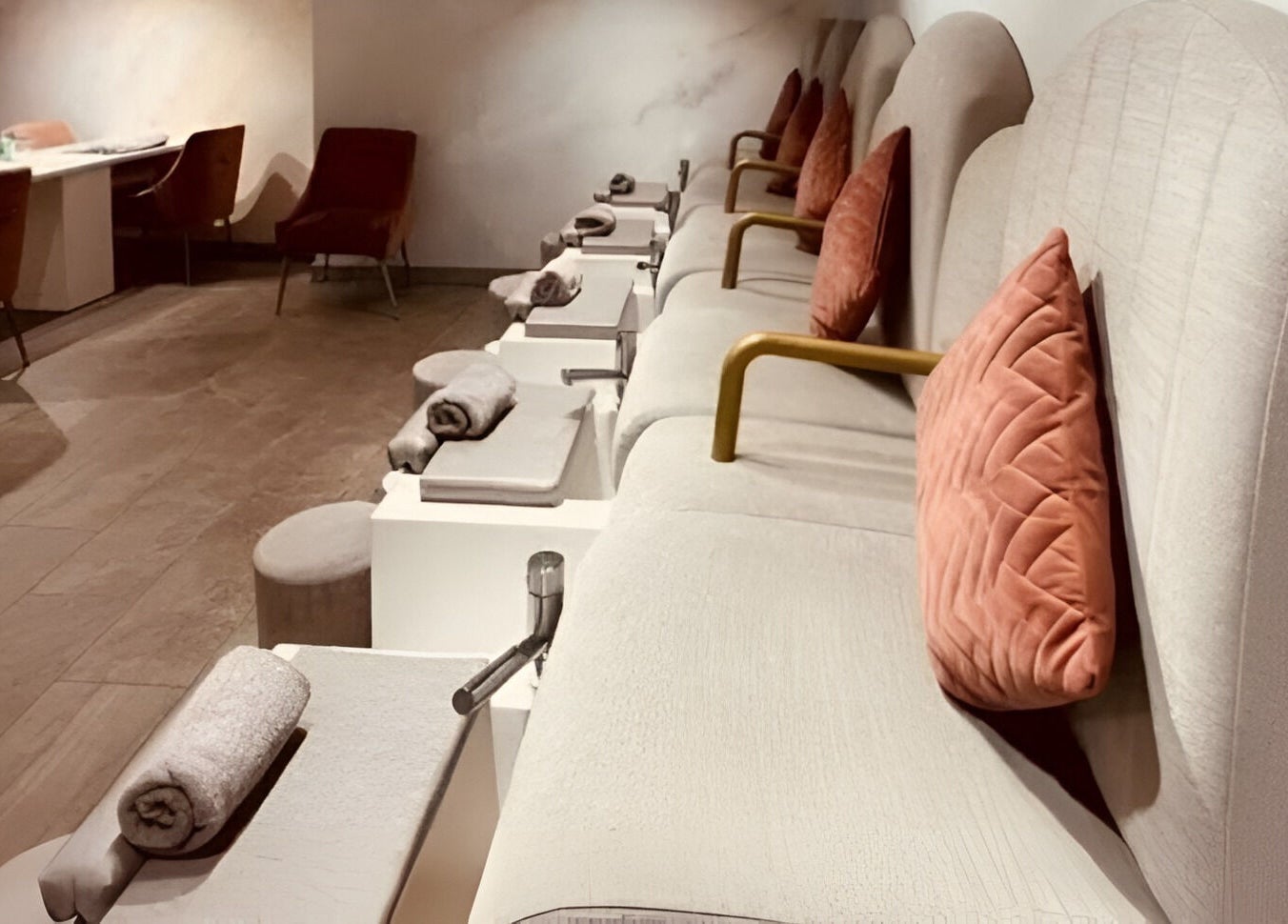 Luxurious seating area at Londora Nail Boutique, London, England, GB, featuring plush chairs and cozy decor.