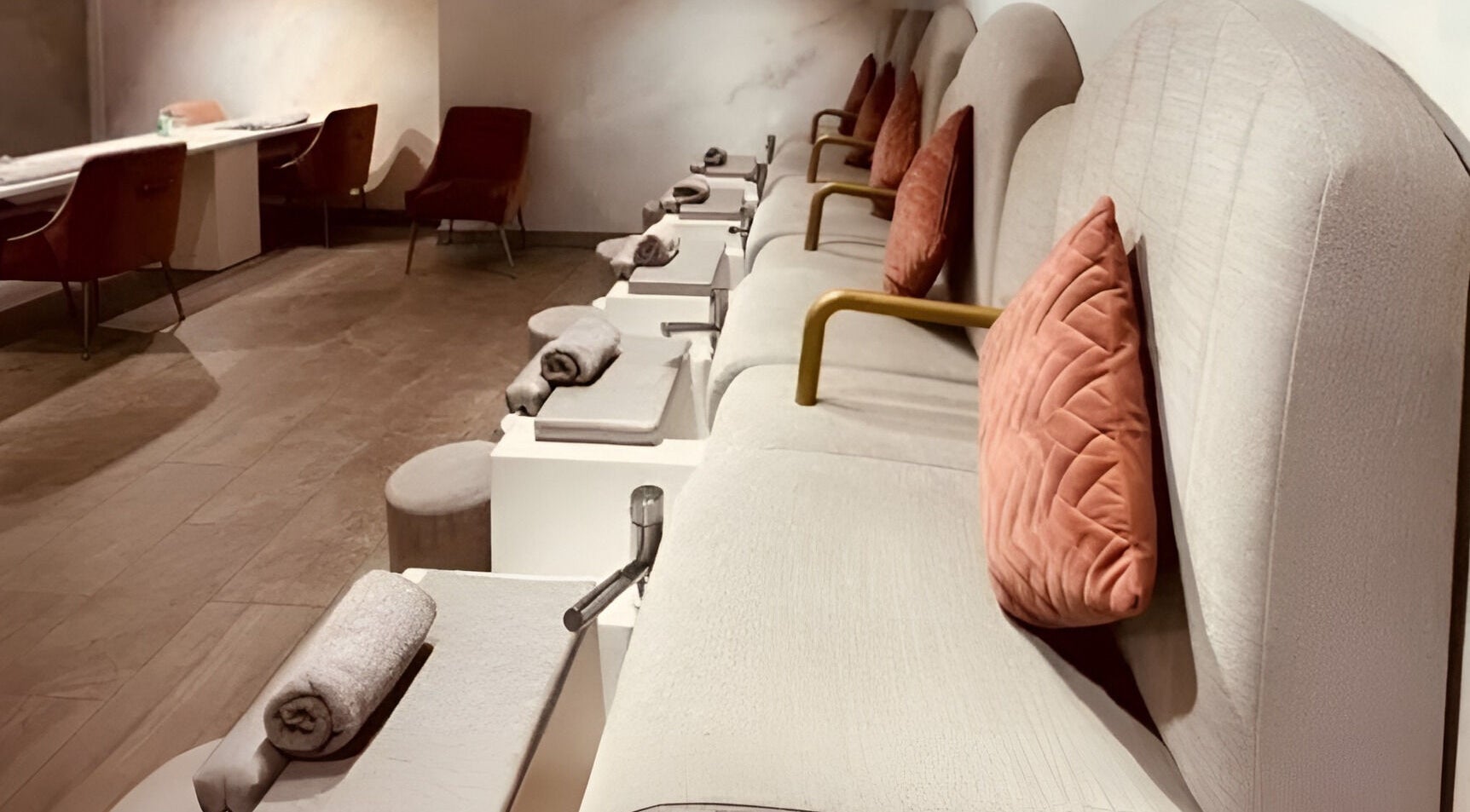 Luxurious seating area at Londora Nail Boutique, London, England, GB, featuring plush chairs and cozy decor.