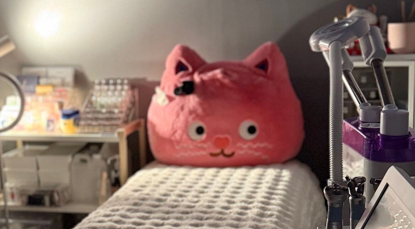 Relaxing treatment area with cozy cat decor at Meow Beauty Bar, Singapore, Singapore, SG.