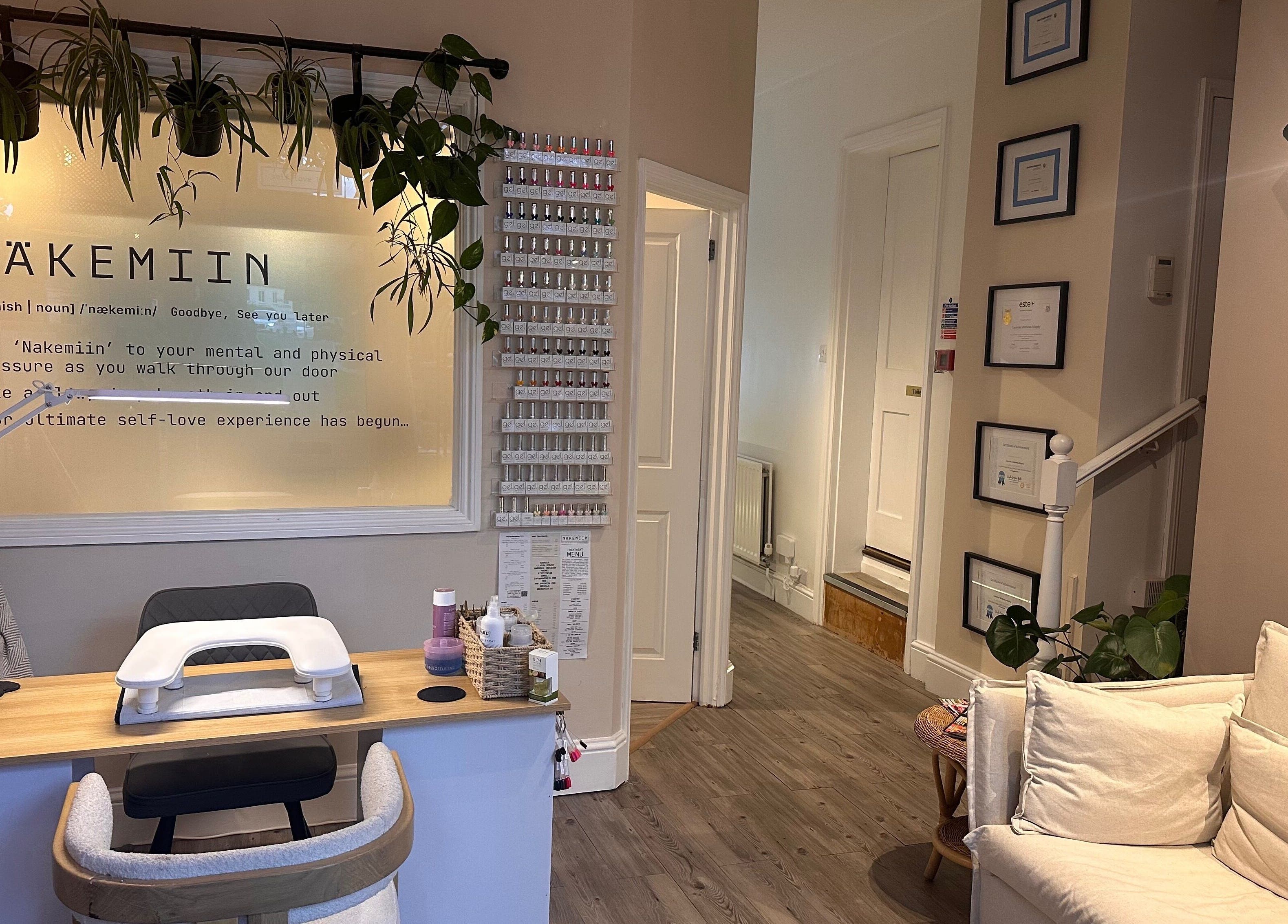 Cozy interior of Näkemiin in Harrold, England, GB, featuring a stylish manicure station and decor.