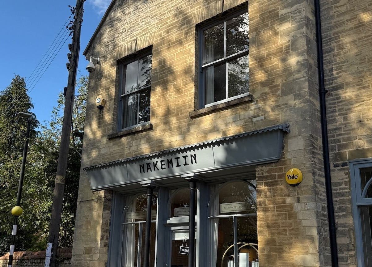 Charming exterior of Näkemiin in Harrold, England, GB featuring classic brick architecture under a blue sky.