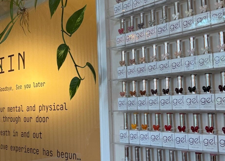 Näkemiin entry wall with nail polish display in Harrold, England, GB, showcasing beauty and relaxation.