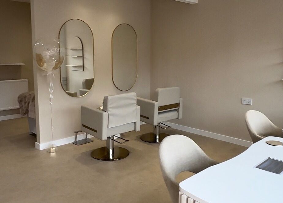 Chic and modern interior of Created salon in Swinton, England, GB with stylish mirrors and seating.