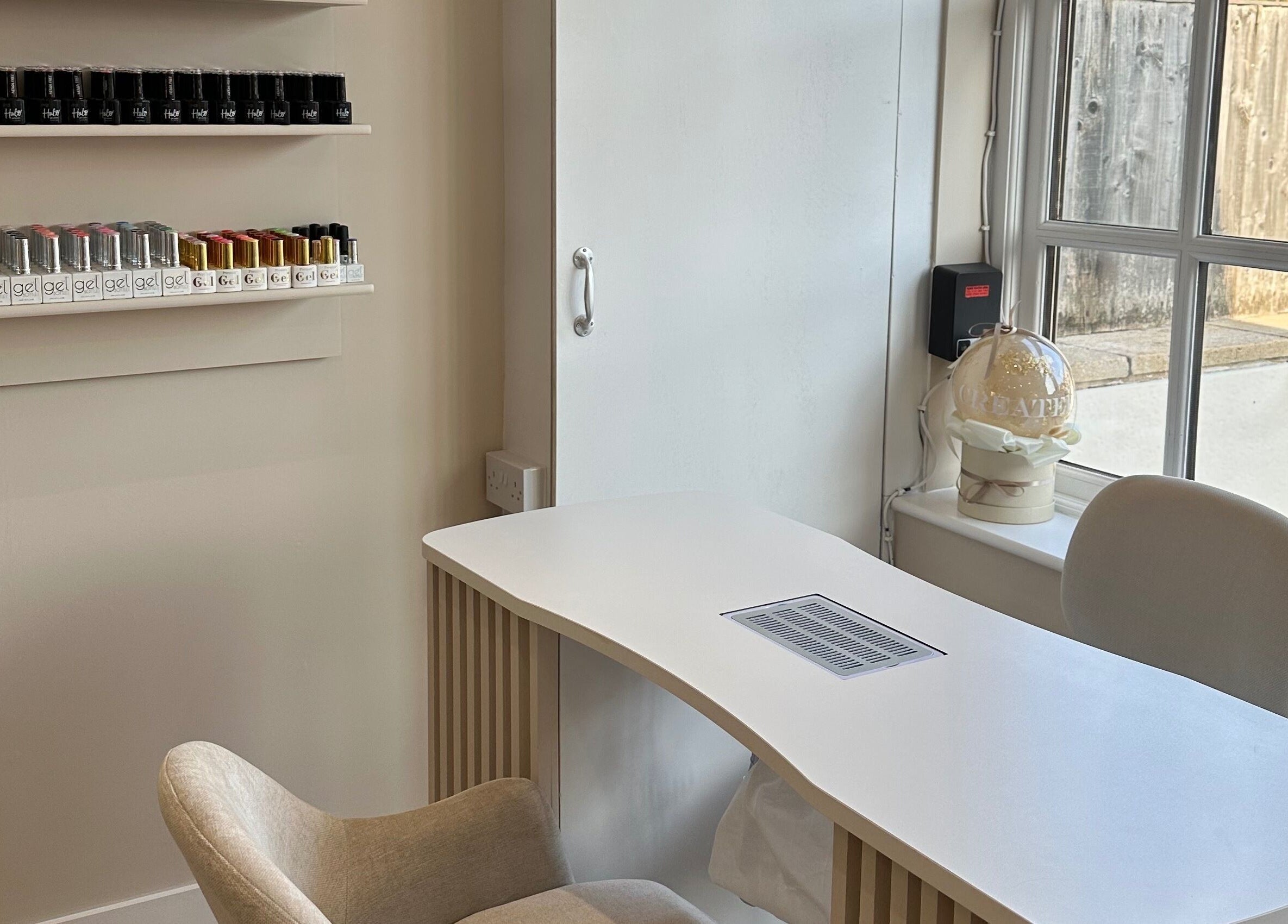 Nail treatment station at Created, showcasing nail polishes in Swinton, England, GB.