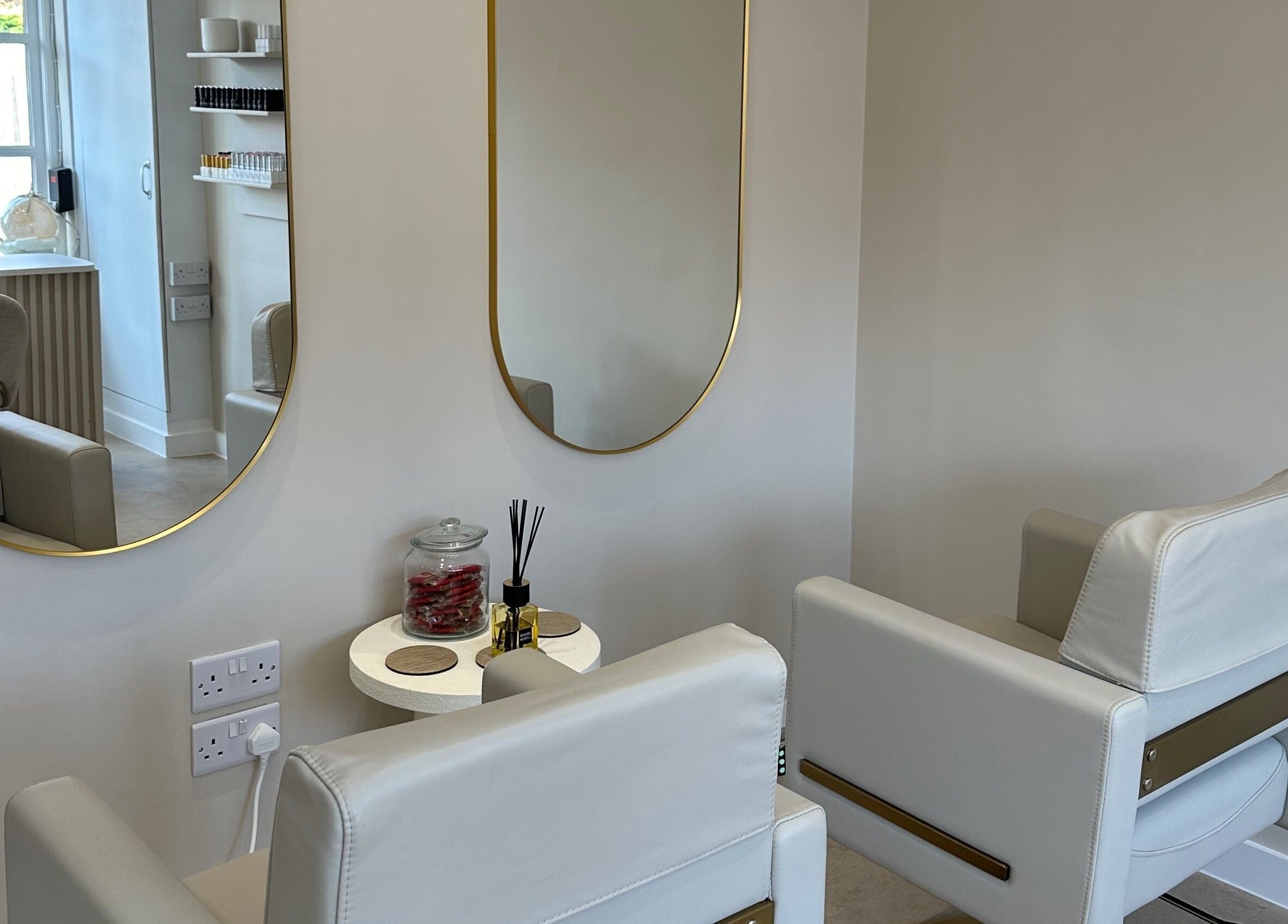 Modern salon chairs and mirrors at Created in Swinton, England, GB, offering a stylish beauty experience.