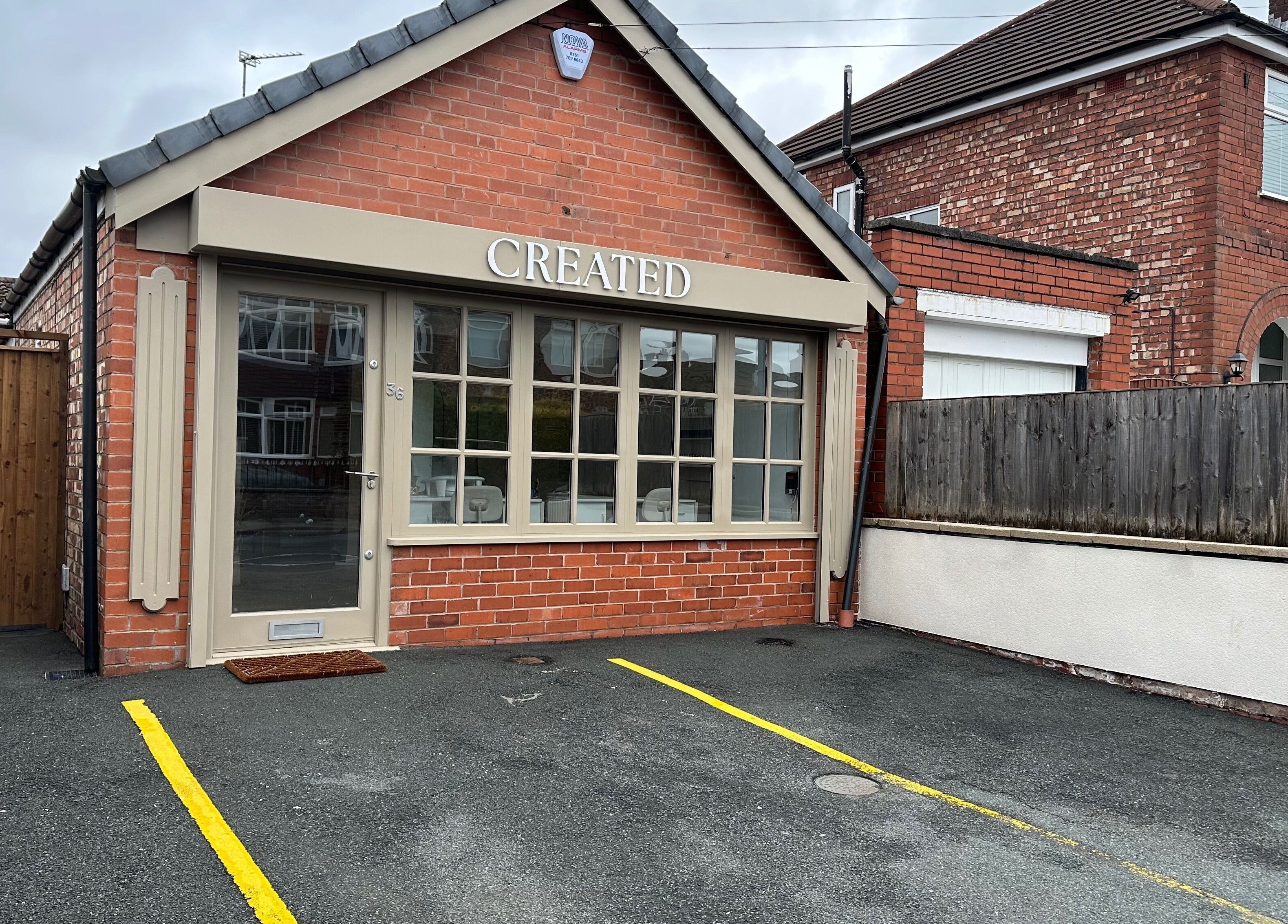 Front view of Created beauty venue, Swinton, England, GB, showcasing its elegant brick design.