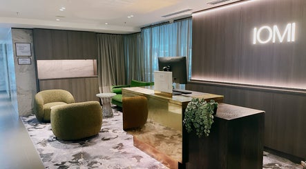Luxurious reception at IOMI Spa at Sheraton Hotel, Melbourne, Victoria, AU, with plush seating and modern decor.