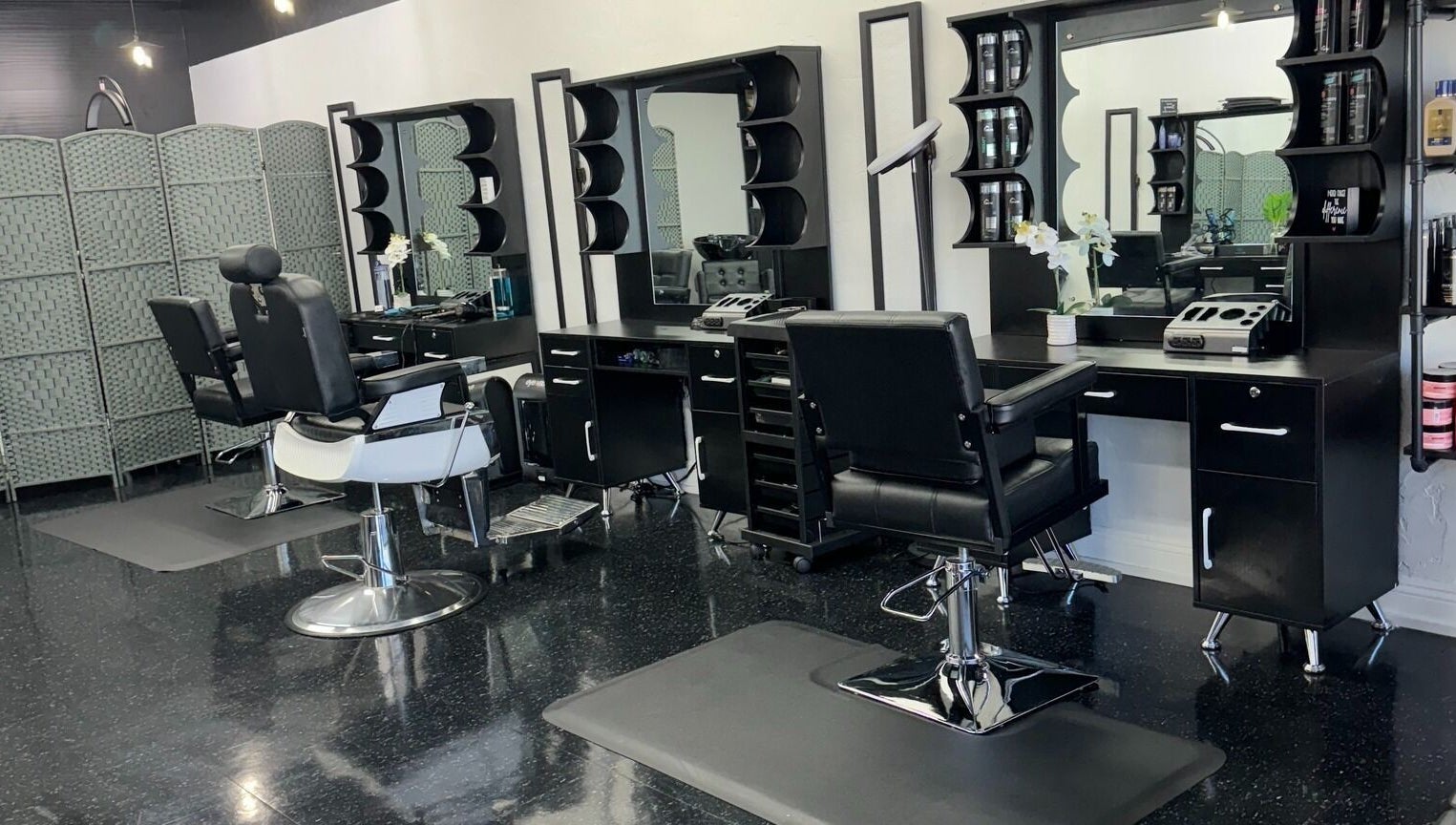 Modern styling chairs and mirrors in Leghecy Beauty Salon, Costa Mesa, California, US.