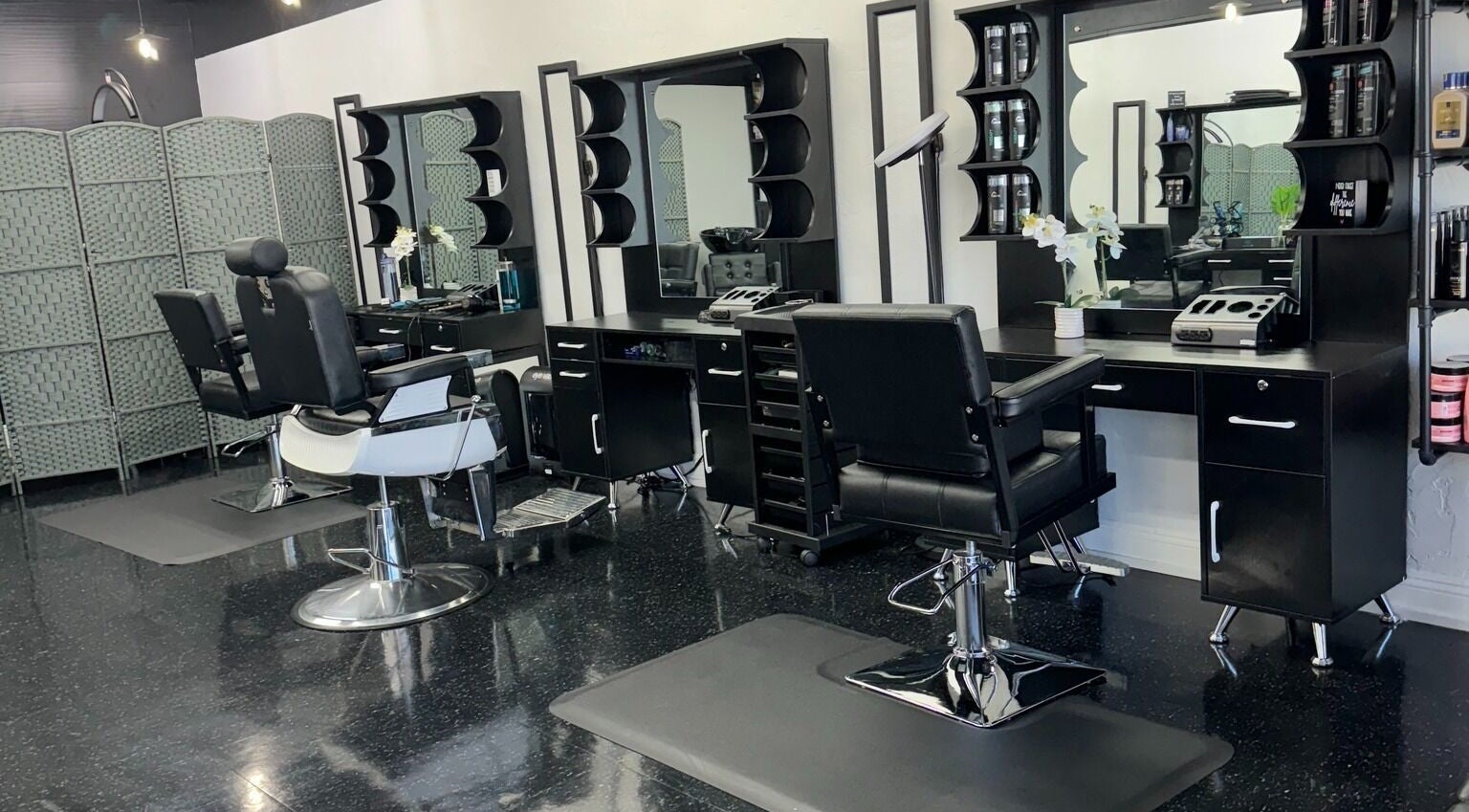 Modern styling chairs and mirrors in Leghecy Beauty Salon, Costa Mesa, California, US.