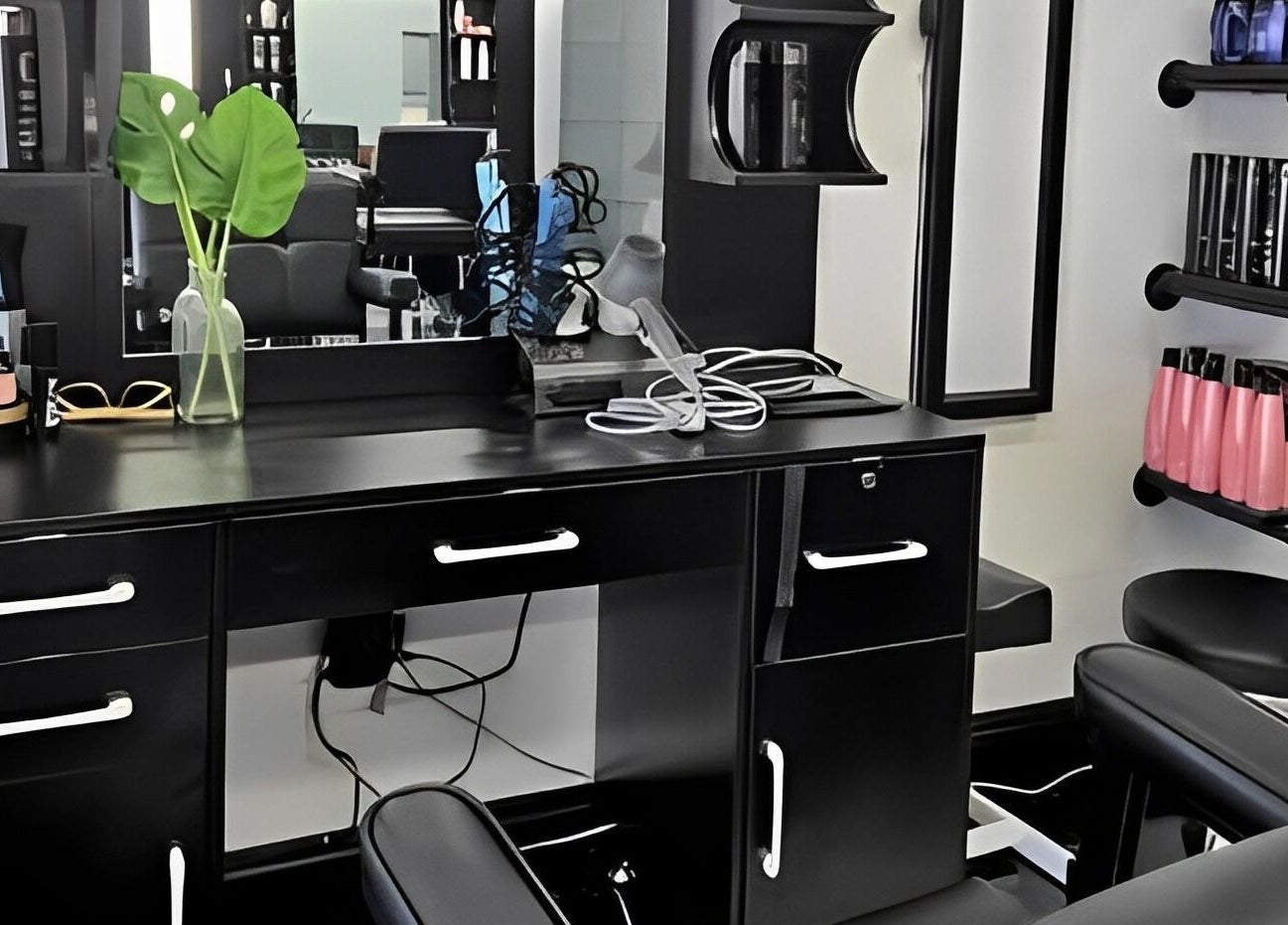 Elegant styling station at Leghecy Beauty Salon in Costa Mesa, California, US, featuring sleek decor and products.