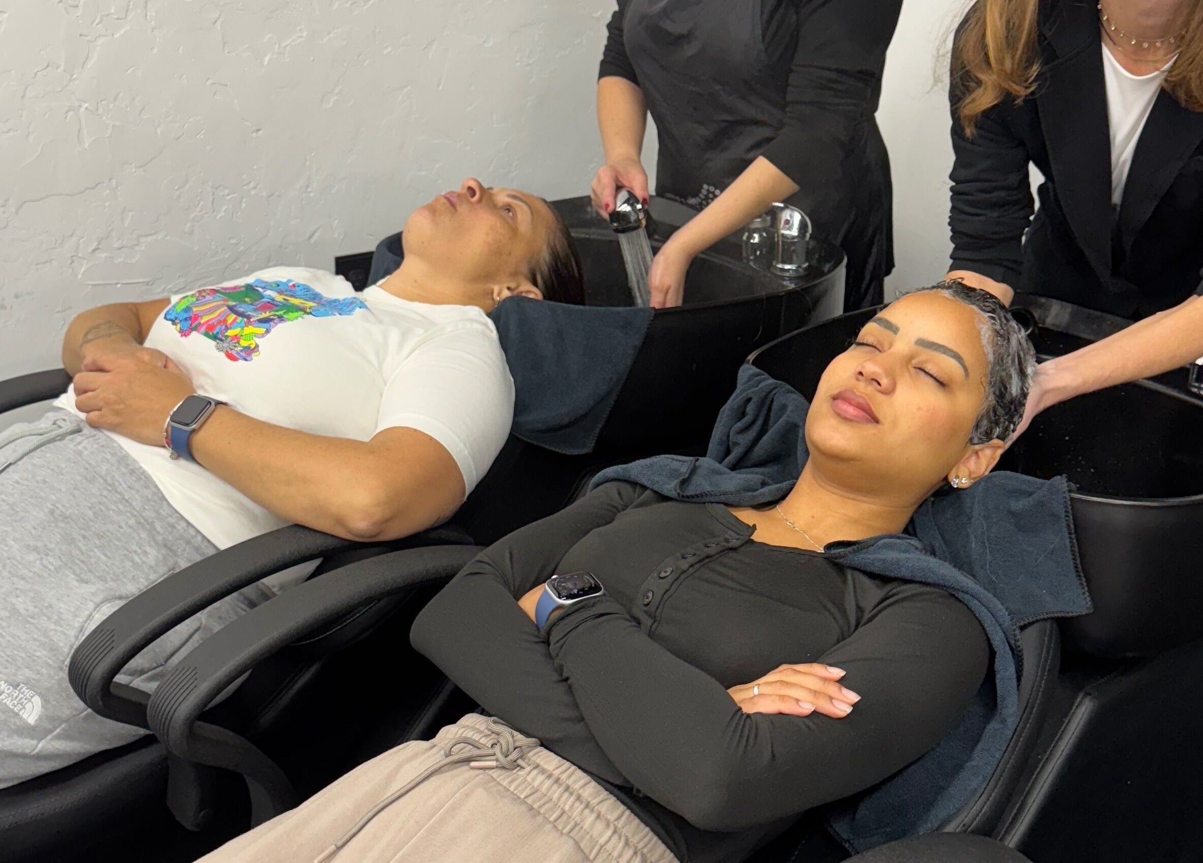 Clients enjoying hair wash at Leghecy Beauty Salon in Costa Mesa, California, US.