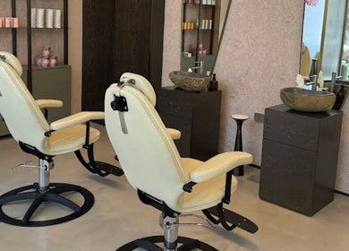 Luxurious salon chairs at Skinlyft, offering premium beauty services in Dubai, Dubai, AE.
