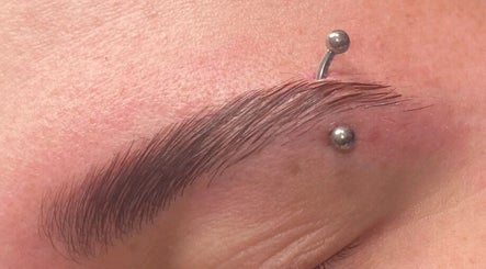 Stylish eyebrow piercing showcased at Diversity Beauty Studio, Cwmbran, Wales, GB.