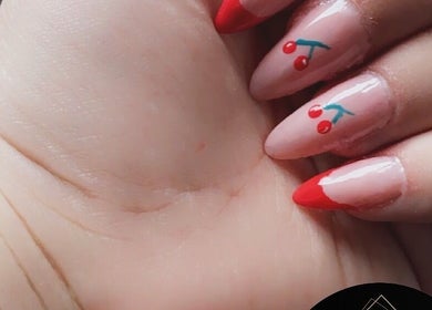 Chic cherry nail art at Diversity Beauty Studio in Cwmbran, Wales, GB, showcasing unique designs and elegance.