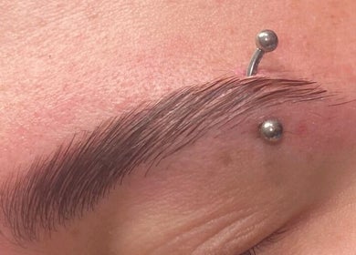 Eyebrow piercing and groomed brow at Diversity Beauty Studio, Cwmbran, Wales, GB enhancing facial aesthetics.