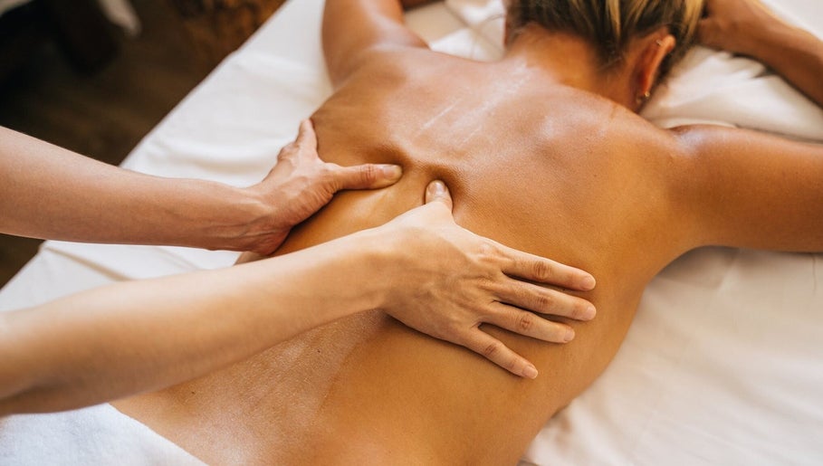 Therapist performing back massage at Diversity Skin & Beauty Studio, Cwmbran, Wales, GB.