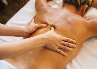 Therapist performing back massage at Diversity Skin & Beauty Studio, Cwmbran, Wales, GB.