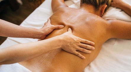 Therapist performing back massage at Diversity Skin & Beauty Studio, Cwmbran, Wales, GB.