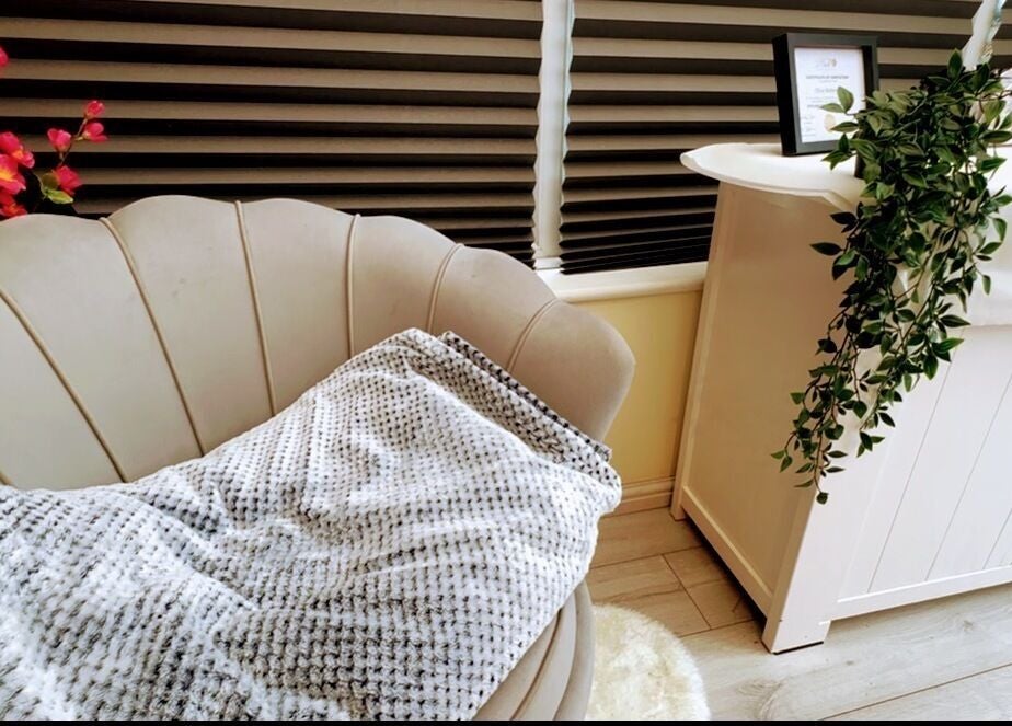 Elegant seating area with plush chair at The Vines Of Beauty, Leeds, England, GB, accented by greenery and decor.