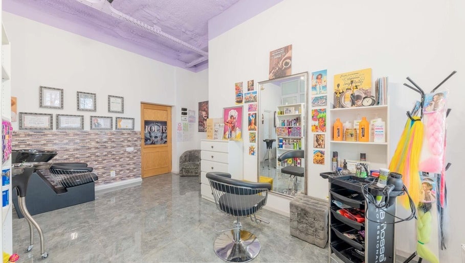 Bright and chic interior of Salon Jolie by Marie with colorful decor in București, București, RO.
