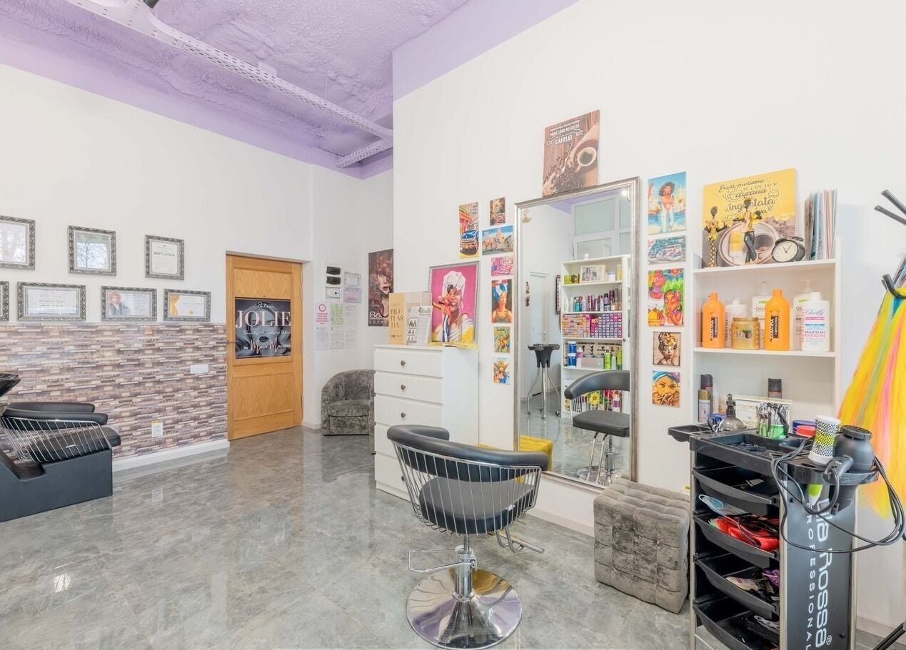 Bright and chic interior of Salon Jolie by Marie with colorful decor in București, București, RO.