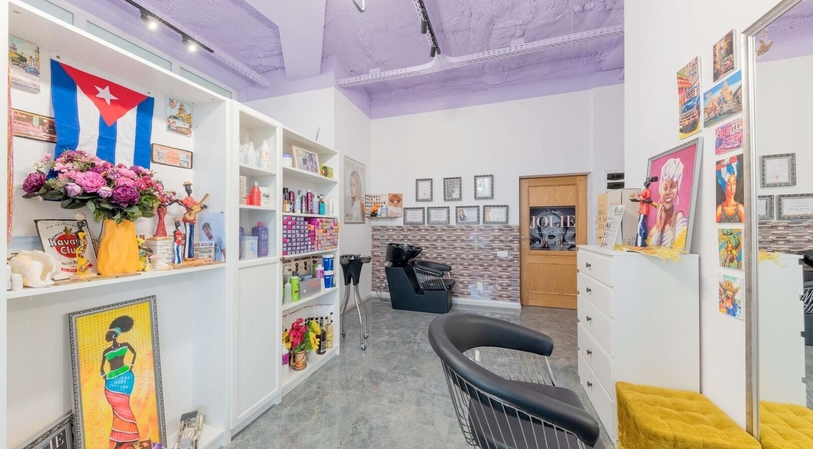 Colorful interior at Salon Jolie by Marie in București, București, RO, showcasing vibrant decor and beauty products.