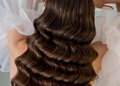 Luxurious wavy brunette hairstyle perfected at Salon Jolie by Marie in București, București, RO.