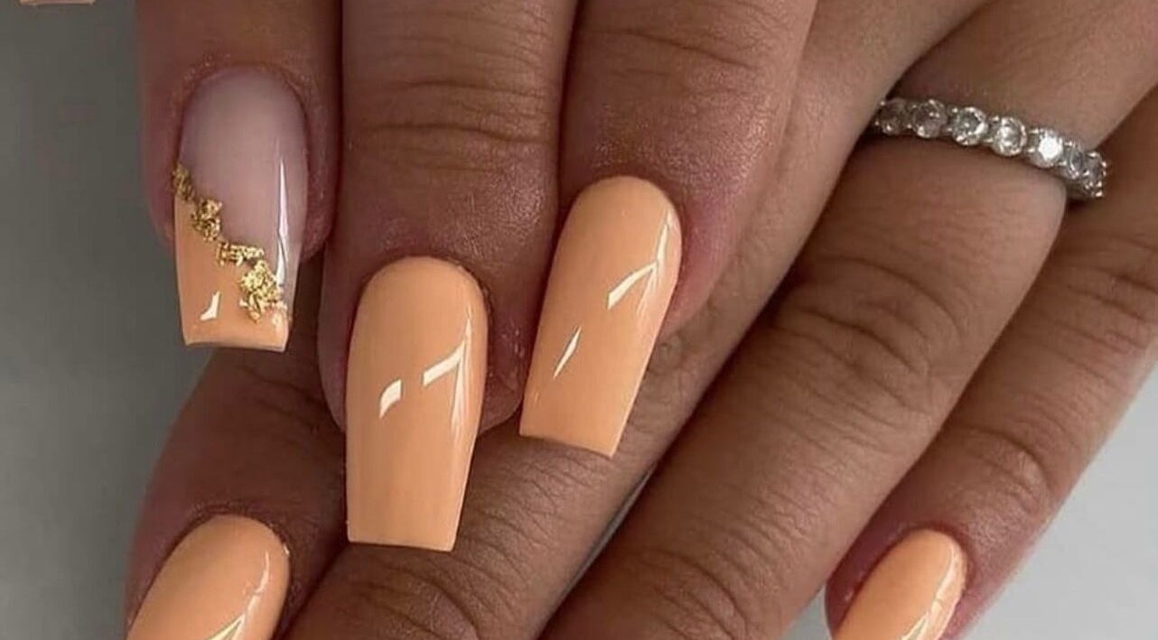Elegant peach nails with gold detail at Vip Nails By Wafa, Glasgow, Scotland, GB.