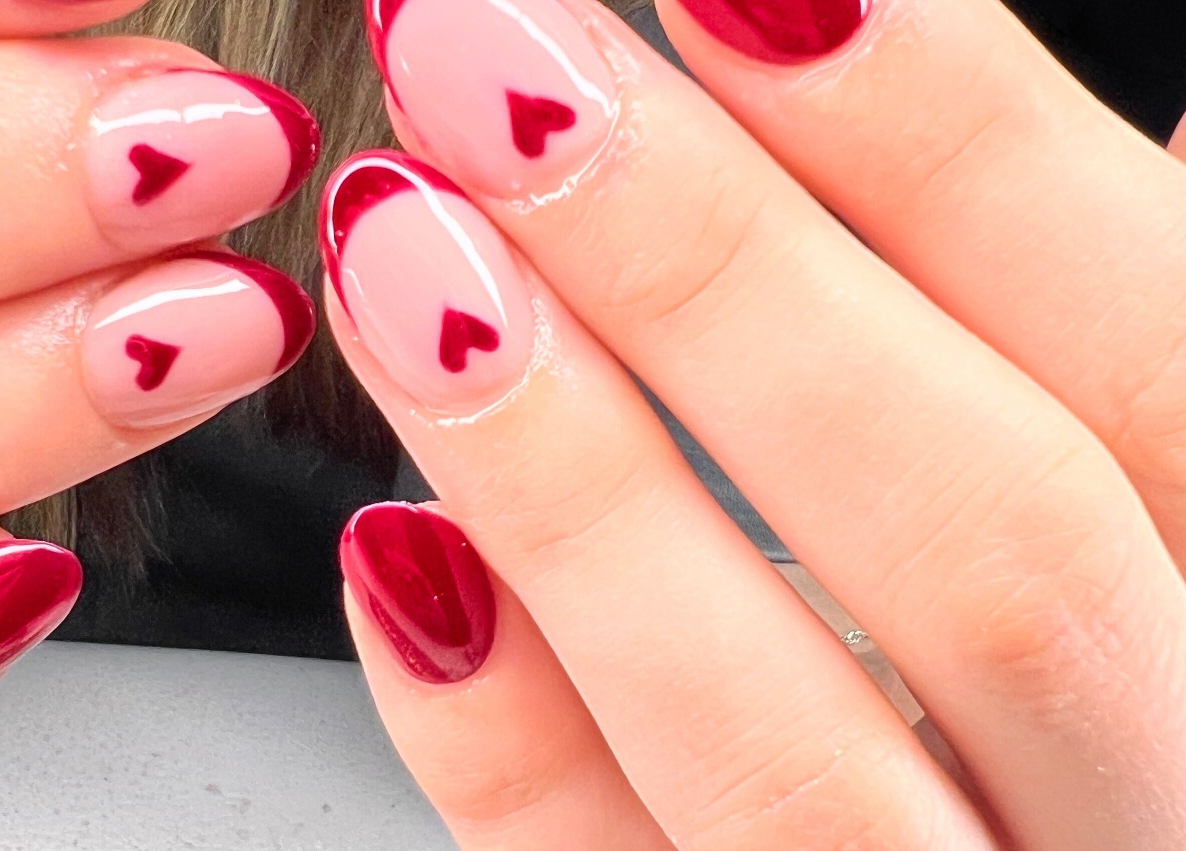 Elegant red and pink heart nail art at Vip Nails By Wafa in Glasgow, Scotland, GB.