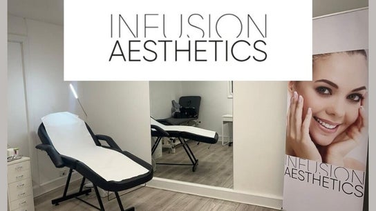 Modern treatment room at Infusion Aesthetics UT Clinic, Burgess Hill, GB, featuring a sleek massage bed and mirror.
